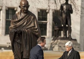 New statue of Gandhi unveiled in Parliament Square. Prime Minister David Cameron shakes hands with Mahatma Gandhi's grandson, Shri Gopalkrishna Gandhi